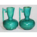 A pair of Christopher Dresser for Lear pottery vases, height 15.5cm. Condition - two chips to base