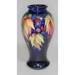 A Moorcroft pottery vase, height 22.5cm, impressed and painted marks to base. Condition - no