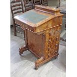 A Victorian inlaid walnut Davenport desk, height 88cm, width 56cm and depth 56cm. The top is loose.