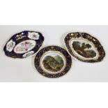 Three Derby porcelain dishes comprising two with landscape scenes, one entitled View in Wales and