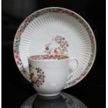 A Worcester porcelain cup and saucer, circa 1765, reeded form and decorated in Old Worcester