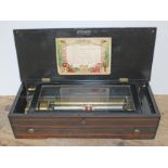 A Swiss 19th century eight airs music box, inlaid rosewood case, length 56cm.
