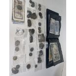 A collection of various European coins and banknotes.