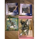 A group of model aeroplanes comprising a Dinky Stuka, two Atlas Editions on stands, two boxed