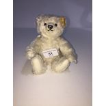 A Steiff bear, 028496, mohair, Little Angel with a metal star on tip of wing. Seated, height