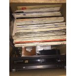 A box of LPs, a Philips CD player, etc.