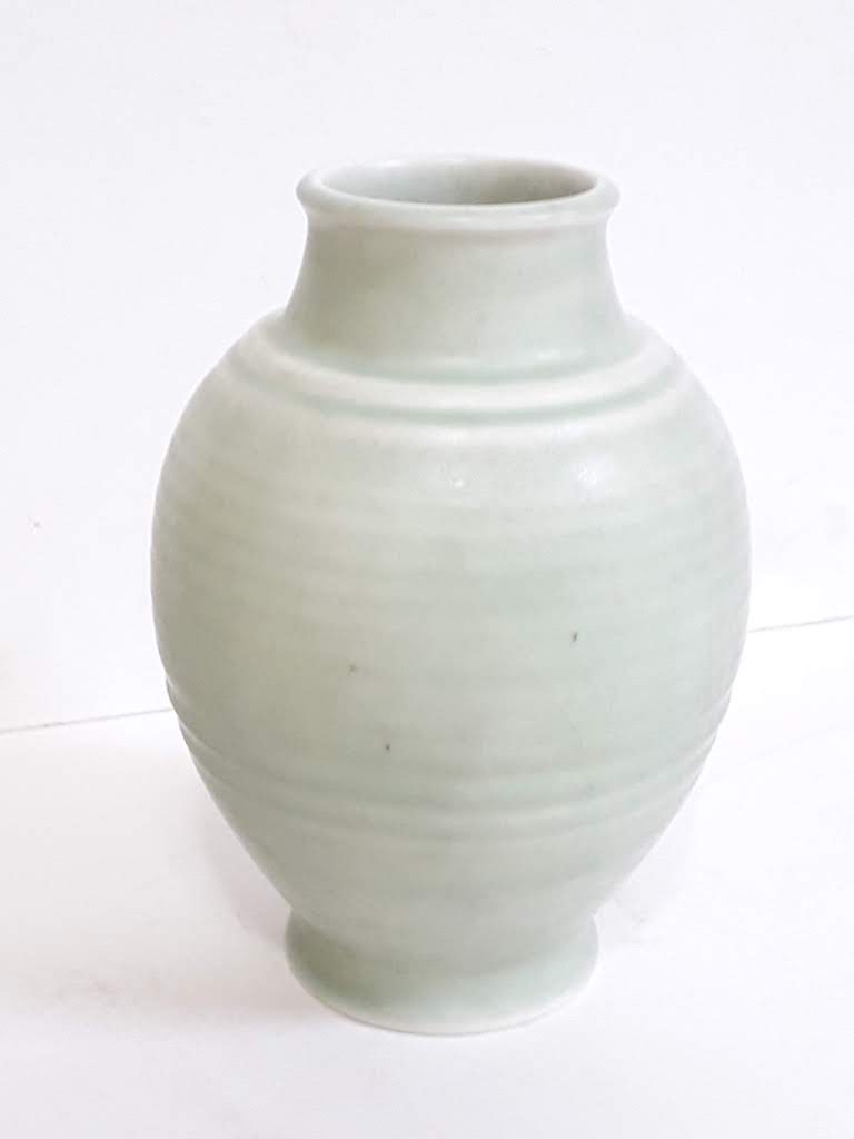 A Pilkington's Royal Lancastrian mint green ribbed vase number 3014, height 22cm.