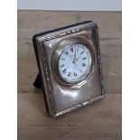 A hallmarked silver desk clock.