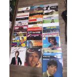 A box of over 40 Cliff Richard LPs, together with 2 boxed sets