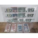 A collection of twenty two British bank notes including early one pound and five pound notes and a