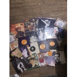 A collection of David Bowie records (5), 45's (16) and photographs.