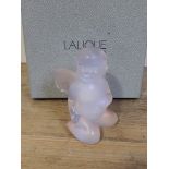 A boxed Lalique figure modelled as a cherub.