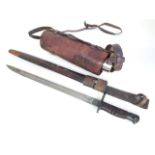 A WWI Remington bayonet and scabbard together with an Otico Flask.