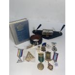 A vintage Masonic deskstand with perpetual calendar and various jewels/ medals and belt