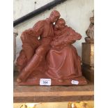 A J.Bezdek 1941 terracotta group, 'The Family', signed