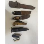 Box containing eight knives, folding, horn handled, etc