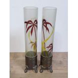 A pair of WMF Art Nouveau brass and glass vases, the bases with fish amongst flowers, height 32.5cm.