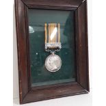 A Queens south Africa replica medal framed.
