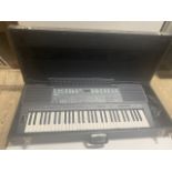 A Yamaha PSR-400 keyboard with hard case