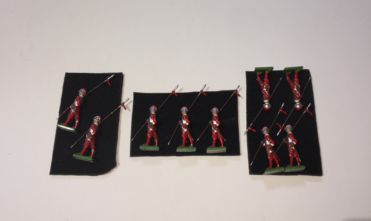 A box of nine Brittain's models No.5852, hon artillery co. Pikeman