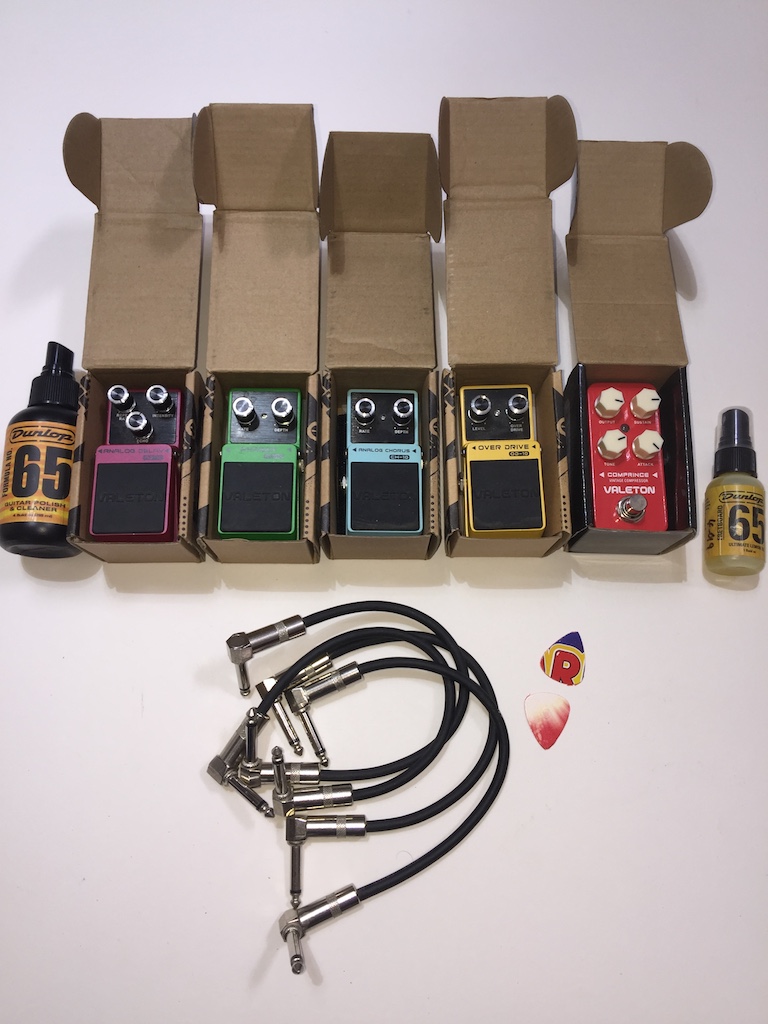 A box containing five Valeton mini guitar effect pedals - Coral Series Comprince Vintage compressor;