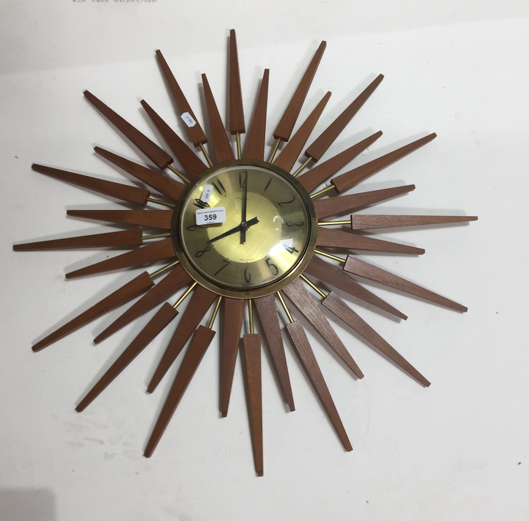 A retro wooden starburst clock