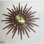 A retro wooden starburst clock