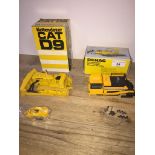 A CAT D9 Track-Type Tractor model in box and a Demac Road Finisher model in box