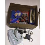 A box containing Hornby Duplo accessories, controller, transformer, various track and a Hornby