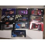 A collection of ten boxed model vehicles to include a burago Ferrari 360 Modena 3358, a Solido