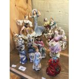 A collection of figurines to include 2 x blue and white figures, Delft salt and pepper condiments, a