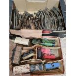 A box of Hornby clockwork toy railway items