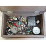 A wooden box and contents including a hallmarked silver vesta, a ladies silver pocket watch, various