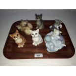 A group of cat models comprising four 1960s Beswick, one Lladro and one Nao.