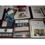 A stamp collection, six albums comprising FDCs, coin covers, mint stamp presentation packs etc.