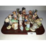 A collection of Beswick Beatrix pottery figures and Hummel figures.