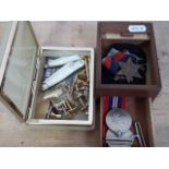 Assorted items comprising a WWII trio, two hallmarked silver and mother of pearl fruit knives,