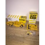 A CAT D9 Track-Type Tractor model in box and a CAT627 Push-Pull Scraper model in box