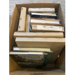 A box of books including Dickens and various books on Geology