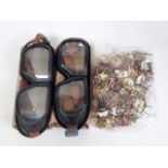 A bag of Russian badges and goggles.