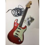 A stratocaster style guitar body in Candy Apple Red and neck. Pickups and pots etc have been removed