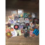 A small collection of 45's to include Pixies, Iron Maiden, Alice Cooper, Happy Mondays, Def