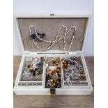 A jewellery box and contents including amber beads, various silver jewellery, a ladies Rotary