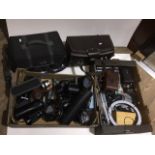 Two boxes containing camera equiptment including lenses bags etc