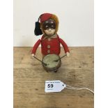 A Schuco patent drumming monkey clockwork toy, with makers mark to foot, no Key, H 11cm