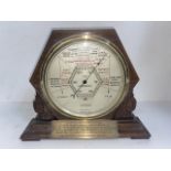A 1930s oak cased barometer, height 28.5cm.