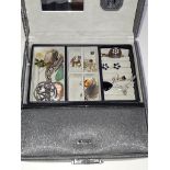 A box of costume jewellery including a Scottish hallmarked silver stag's head brooch, a hallmarked