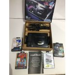 A Sega Megadrive games console in original packaging, with 2 handsets, power cables, and 5 games -