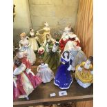 A collection of 13 Royal Doulton figurines
