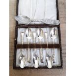 A cased set of six hallmarked silver spoons and a Columbian Exposition spoon.